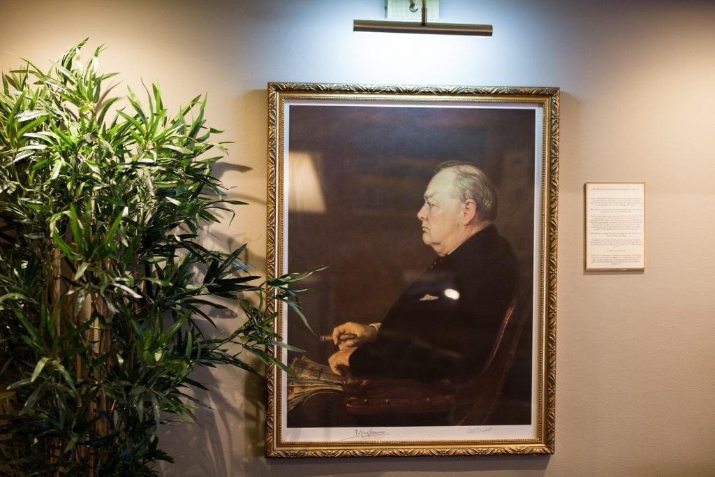 A portrait of Winston Churchill sat in a chair inside the cigar merchants is seen at James J. Fox cigar merchant in London. See National New story NNCIGAR; Cigar lovers celebrate the birth of Winston Churchill in one of the only indoors smoking rooms at London's oldest cigar merchant.