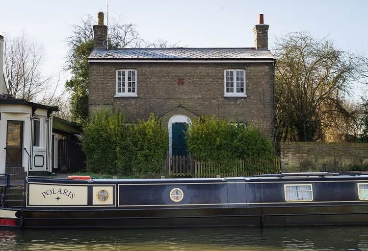 Ferry House situated on the bank of the river cam in Cambridge next to the Fort st George pub and close to the Mihelin star restaurant Midsummer house. See SWNS copy SWCOUNCIL:A riverside home with a Michelin-starred restaurant on its doorstep is set to become one of the UK’s most expensive COUNCIL HOUSES after it was put on the market for £750,000.Ferry House is a three-bedroom 'doer upper', which sits on the bank of the River Cam in Cambridge. It is in heart of the historic city centre and within half-a-mile of a mixture of ancient and modern buildings, colleges and shops.