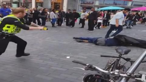 Watch – Man rampaging around city centre with an axe TASERED by police