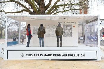 EDITORIAL USE ONLY
Visitors look at artworks inside the Tiger Beer ‘Clean Air Gallery’ in Brixton, the works were created using Air-Ink™, the first ink to be made from captured air pollution before it enters the atmosphere. London. PRESS ASSOCIATION Photo. Picture date: Monday March 27, 2017. Photo credit should read: Matt Crossick/PA Wire