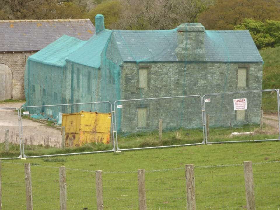 Police investigating after empty farm building completely covered in netting