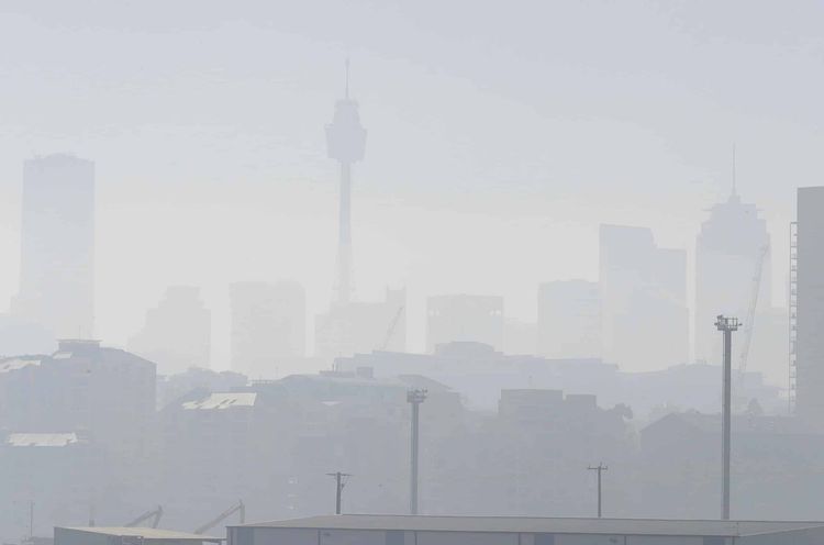 Smoke haze covers Sydney as wildfires burn near the city (Rick Rycroft/AP)