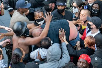 Dramatic photos reveal the melee during the Black Lives Matter protest which led to Patrick Hutchinson and a group of fellow demonstrators saving a white man from the far right racist counter protest after he got into trouble, Waterloo Station, London 13 June 2020. Credit: SWNS