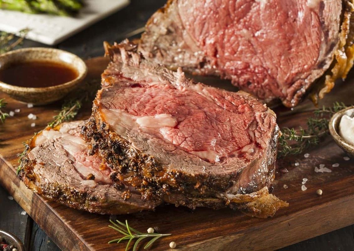 Beef Roast: studded with garlic and roasted to medium-rare perfection.