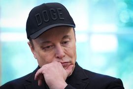 WASHINGTON, DC - MAY 30: Tesla CEO Elon Musk listens as U.S. President Donald Trump speaks to reporters in the Oval Office of the White House on May 30, 2025 in Washington, DC. Musk, who served as an adviser to Trump and led the Department of Government Efficiency, announced he would leave his role the Trump administration to refocus on his businesses. (Photo by Kevin Dietsch/Getty Images)