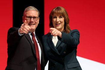 LIVERPOOL, ENGLAND - SEPTEMBER 29: Prime Minister Keir Starmer and Chancellor of the Exchequer Rachel Reeves react on stage during day two of the Labour Party conference at ACC Liverpool on September 29, 2025 in Liverpool, England. The Labour Conference is being held against a vastly different backdrop to last year when the party had swept to power in a landslide general election victory. A year on and polling shows three quarters of Britons (74-77%) say they have little to no trust in the party on the cost of living, immigration, taxation, managing the economy, representing people like them, or keeping its promises. (Photo by Jeff J Mitchell/Getty Images)