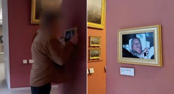 Andrew arrest photo hung up in Louvre