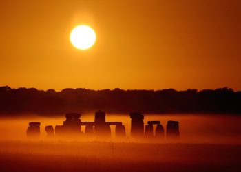 SWNS Pictures of the Year 2015 - One hundred of the most compelling images on the SWNS wire this year as chosen by our picture editors.

The sun rises over Salisbury Plain as it's light illuminates the mist shrouding Stonehenge, Wiltshire, July 7 2015. Amateur photographer Robin Morrison made half a dozen visits to the ancient megalith, travelling over a hundred miles each time, to capture the precise lighting conditions he wanted. The normal weather patterns in the UK mean that a clear sky just a few minutes after sunrise is uncommon - a clear sky at sunrise combined with a misty morning is an extremely rare occurrence.