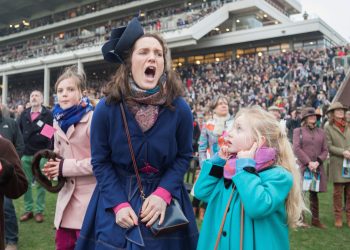 SWNS Pictures of the Year 2015 - One hundred of the most compelling images on the SWNS wire this year as chosen by our picture editors.

(Left - right) Amelia Tinkler, 9, niece of jockey Andrew Tinkler, Sophie Burkin, 25, and Daisy Tinkler, 6, react whilst watching racing on Ladies Day at Cheltenham Festival. Cheltenham Racecourse, Cheltenham, England. March 11 2015.