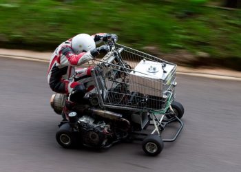 Matt Mckeown 55 drives the uphill course in his converted shopping trolley. Shelsley Walsh Hill Climb, Shelsley Walsh, Worcestershire. September 04, 2016.  This is the bizarre moment a petrol head competed in a motorcycle road race - in a jet-powered SHOPPING TROLLEY. See NTI story NTITROLLEY.  Madcap Matt McKeown, 55, of Plymouth, Devon, build his wacky racer - which has a top speed of 80mph - from an abandoned cart he found in a ditch.  He bolted on brakes, go-kart wheels and a 150 horsepower engine from a Chinook helicopter before taking it for time trials.  Matt first set a record of 45.5mph then made several tweaks and broke his own record by reaching 71.4mph at Elvington Airfield in North Yorks.  On Sunday (4/9) Matt wowed the crowds when he competed in the Shelsley Walsh Hill climb in Worcestershire.  Despite crawling up the 1,000 yard course - which hits a steep 1:7 incline at its peak - Matt wasn't last to finish and managed to beat a number of other conventional bikes.