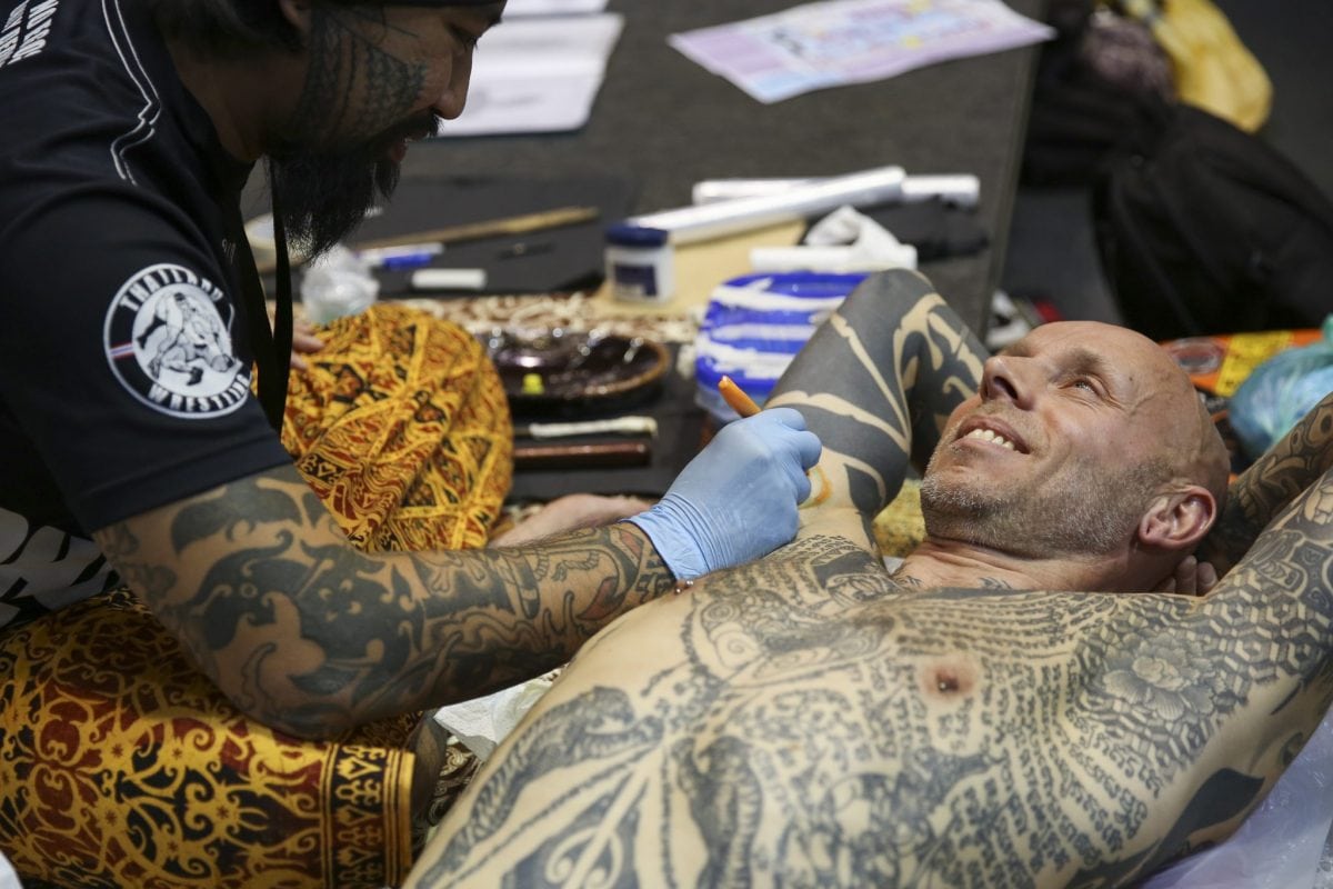 Tattooing at the London Tattoo convention in Shadwell, East London. . 23 September 2016.