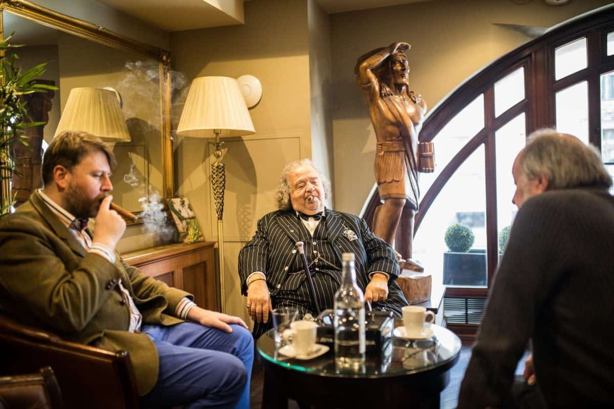 People smoke inside James J. Fox cigar merchant in London. See National New story NNCIGAR; Cigar lovers celebrate the birth of Winston Churchill in one of the only indoors smoking rooms at London's oldest cigar merchant.