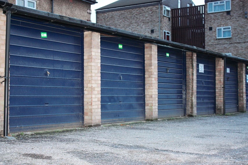 The garage doors in Midsummer Avenue, Hounslow. See SWNS story SWGARAGES3; Councils in London could build more than 16,000 homes by using space taken up by the unused or rundown garages it owns, according to new research. A study of local authority-owned lock-ups revealed 24 councils own 53,640 garages in the capital - with 41 per cent empty or in disrepair. Demolishing the garages and replacing them with affordable one-bedroom flats could go someway to solving the London housing crisis, where the average home now costs £475,000.  The figures were revealed in a Freedom of Information request by property crowdfunding platform Property Partner. Researchers at property firm calculated the total square footage of 22,000 council-owned empty garages in London was more than eight million. If these garages were replaced with developments made up of 500 sq/ft flats, it is estimated 16,000 affordable homes could be built. The London Assembly says the capital needs between 49,000 and 80,000 homes per year to cope with the projected population growth of a million in the next ten years.
