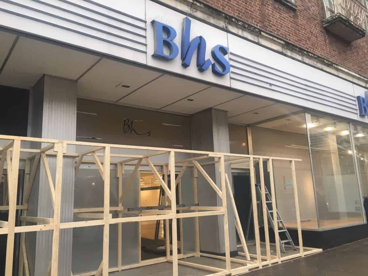 The wooden barrier at BHS on South Street, Exeter, Devon. See SWNS story SWBHS; The wooden barrier - around 10 ft tall - was being constructed today in the entrance of BHS on South Street. Workers say it is to stop rough sleepers from gathering in the doorways. The store has been vacant since the collapse of Sir Philip Green's former chain in August last year. In recent months its entrances had become a shelter to some of Exeter's homeless - including Justin Wilson, 41, and Tia Bamford, 30, who set up a camp beneath the store's southern doorway.