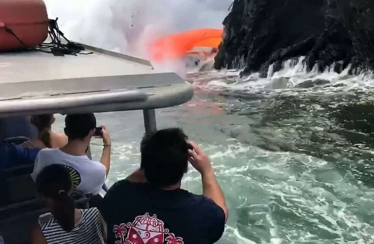 In Pictures: Molten lava spews from collapsed volcano into the sea