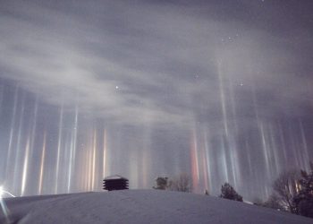 A father captured these stunning images of multicolored pillars beaming down from the sky after waking up at 1.30am and thinking  ALIENS were invading. See SWNS story SWLIGHT; Timothy Joseph Elzinga, 33, got out of bed when two-year-old son Gibson started crying - and he noticed the incredible light show outside. He thought someone from Star Wars was ''trying to beam people up'' - and quickly ran outside to investigate the yellow, green, red and blue lights. The amateur photographer captured the incredible light pillars - caused by crystals of moisture frozen in the air - reflecting light over Ontario, Canada, last Friday.