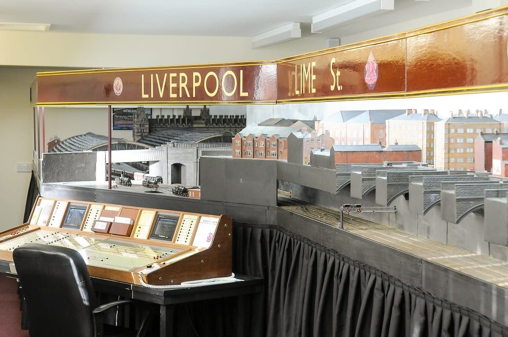 John Holden has built a giant model of Liverpool Lime Street train station. See Ross Parry story RPYTRAIN; A rail enthusiast who fell in love with a train station as a child has now recreated it in full - in his BUNGALOW. Trainspotter John Holden, 69, has built a 45ft replica of Liverpool's Lime Street Station in his house. John has fond memories of trips to Liverpool as a youngster and first had the idea for the model while still a schoolboy. But it took almost 30 years for his dream to come to fruition. John has been crafting the stunning scale model for decades and it even includes station announcements, model trains, working signals and moving taxis and buses. His space-consuming hobby fills the entire extension of the detached bungalow in the East coast seaside town of St Annes, near Blackpool., he shares with wife, Pauline. The model, which shows the station in the 1940s, even boasts a sound system providing ambient background noise, train hooters and whistles and it also includes surrounding streets and nearby buildings, along with tiny figures of railway workers and passers-by. The couple’s current home was specifically chosen because there was space to accommodate the model. John said: “It has just grown and grown.”