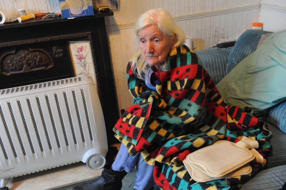 Pictured is Shirley Walsh at her home on Kathleen Road, Hull, where she is forced to use electric heaters, hot water bottles and blankets to keep warm. See Ross Parry story RPYCOLD; A 74-year-old widow has been left "freezing" in her Hull home for months after her gas was cut off leaving her with no central heating or hot water. Shirley Walsh, from east Hull, takes SIX hot water bottles to bed with her at night in a desperate bid to keep warm. The retired seamstress says her supply was cut off in September after workmen found a leak in pipes under her front garden in Kathleen Street, where she has lived for 43 years. But because the leak was on her property, Northern Gas Networks told her she would have to pay for the repair, a cost the pensioner says she can't afford.