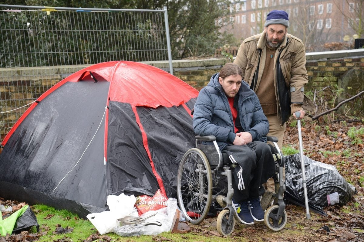 Homeless Jonathan Martin and Chris Stanford who are living in a tent in Chatham. See National News story NNTRAMP; A pair of homeless men have set up camp in a graveyard to escape the abuse they receive on the streets - which they describe as "the jungle". Chris Stanford and Jonathon Martin said they have had things thrown at them, been spat at - and mean-spirited locals have even tried to wee on them. Each day Chris, who uses crutches, helps Jon, who is paraplegic, into his wheelchair and the pair head to the high street in Chatham, Kent, to beg for change. Jon, 38, said he needs a wound on his foot dressed says the district nursing team refuses to visit him because he has no fixed address. *** Local Caption ***
Homeless Jonathan Martin and Chris Stanford who are living in a tent in Chatham. See National News story NNTRAMP; A pair of homeless men have set up camp in a graveyard to escape the abuse they receive on the streets - which they describe as "the jungle". Chris Stanford and Jonathon Martin said they have had things thrown at them, been spat at - and mean-spirited locals have even tried to wee on them. Each day Chris, who uses crutches, helps Jon, who is paraplegic, into his wheelchair and the pair head to the high street in Chatham, Kent, to beg for change. Jon, 38, said he needs a wound on his foot dressed says the district nursing team refuses to visit him because he has no fixed address.