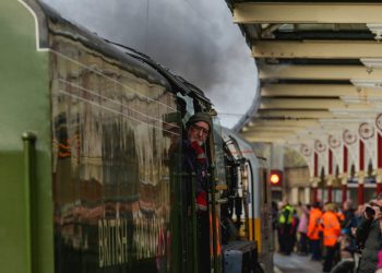The Tornado steam engine comes into the station, pushed by diesel rolling stock, at Skipton station, West Yorks. The nine year old, scale replica locomotive doesn't have enough fuel to make the return journey, so only travels under full steam power when going north. February 14, 2017.