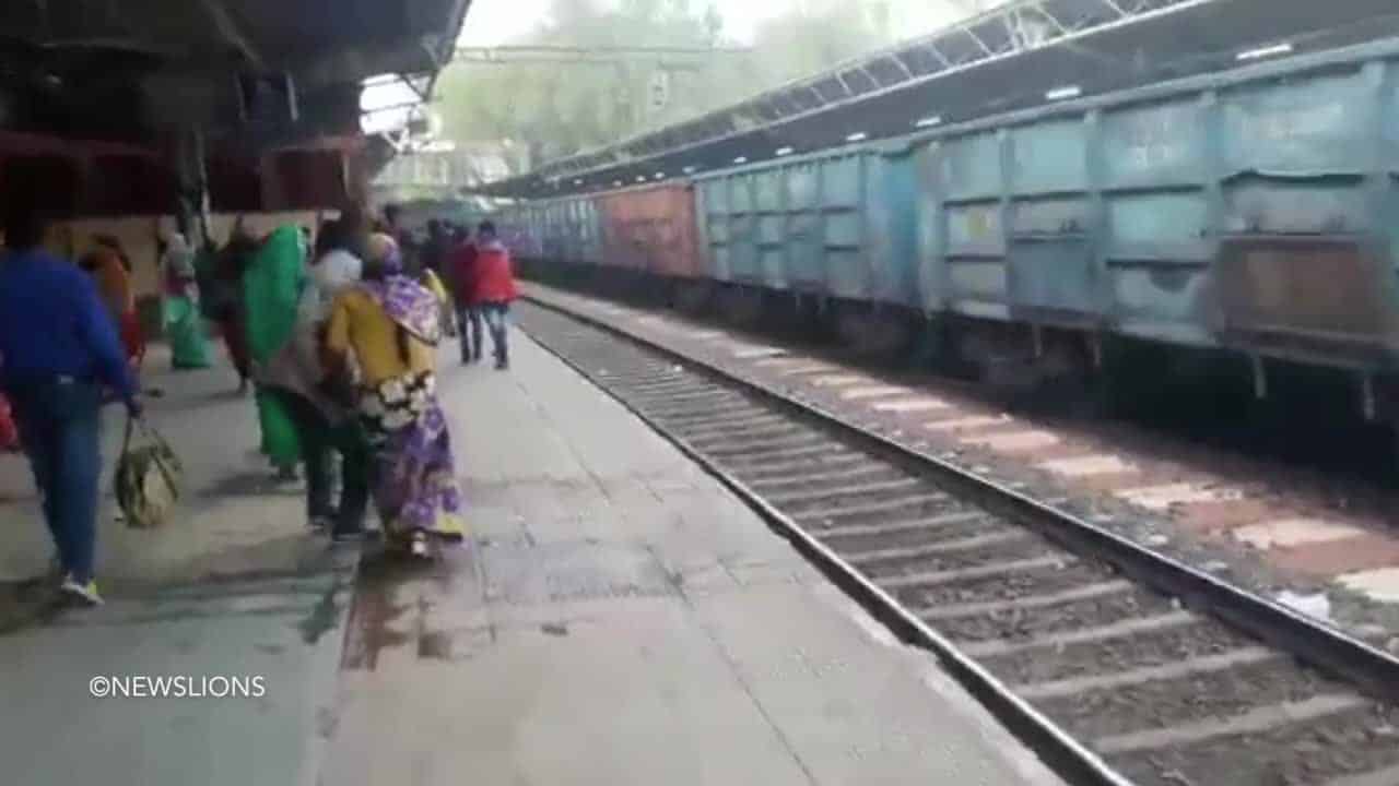 Watch – Woman run over by train miraculously emerges totally unscathed