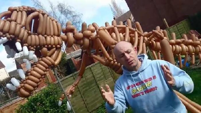 Watch – Father makes 10ft Tyrannosaurs Rex using…balloons