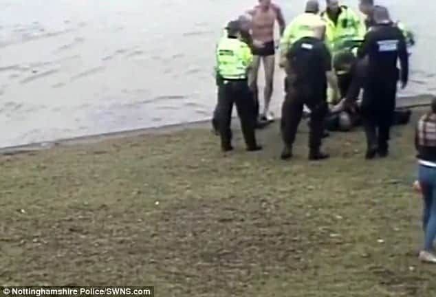 Watch – Brave cop dives into freezing river to save drowning man