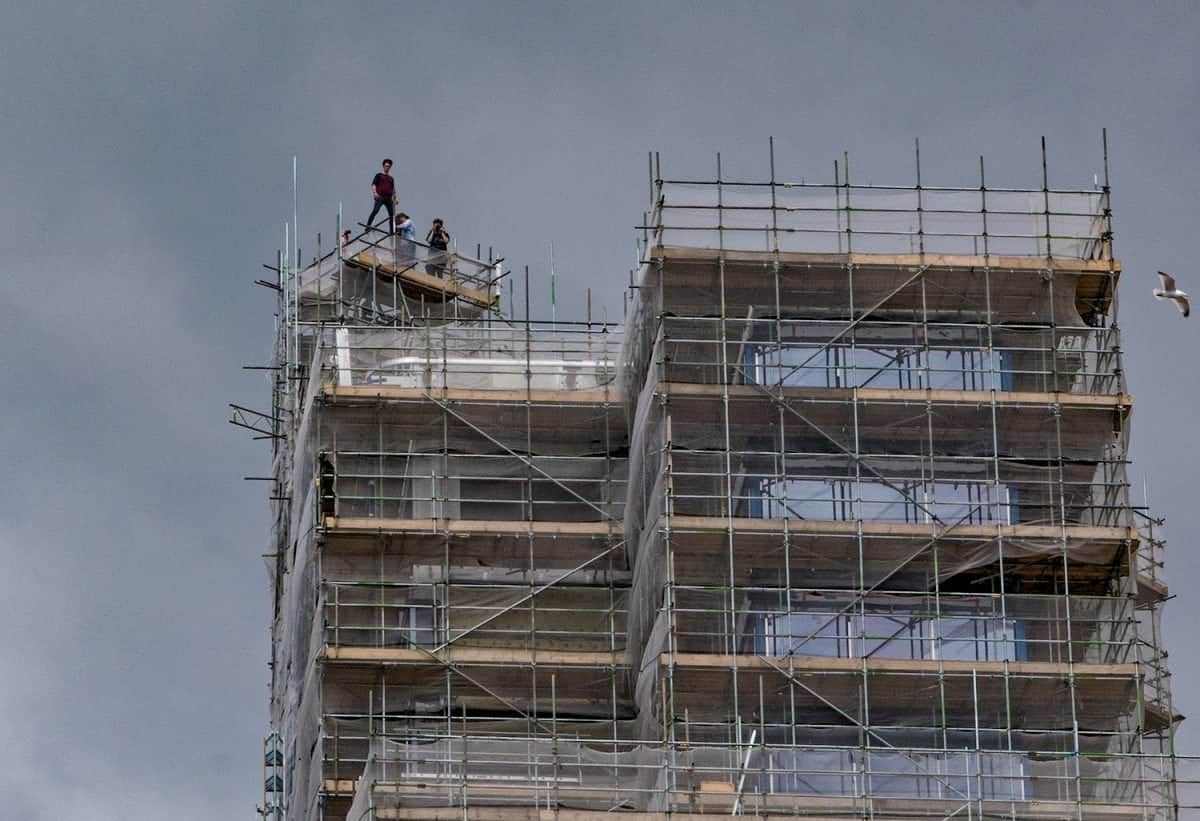 Daredevils break into construction site to perform stunts on the roof