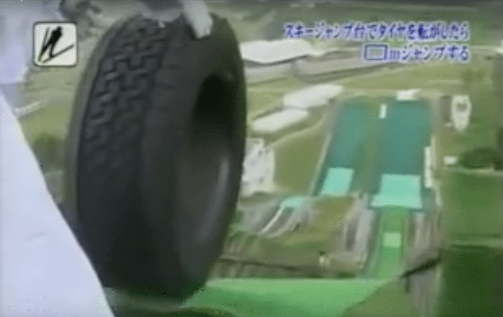 Watching tires roll down a ski jump to see how high they fly for science