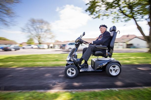 Watch – D-Day veteran aged 92 is given a mobility scooter by the British Legion