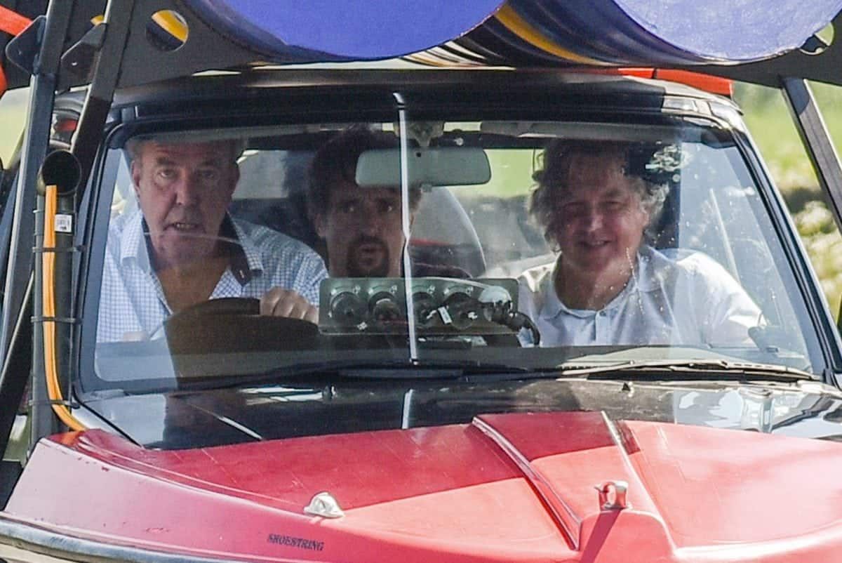 Jeremy Clarkson, accompanied by co-presenters Richard Hammond (in the back seat) and James May (in the front passenger seat), drives an odd vehicle in the outskirts of Huddersfield, West Yorks., May 25 2017. The car appears to be part boat, part car, and part jet engine, and filming has severly disrupted residents in the local village. See Ross Parry story RPYTOUR: