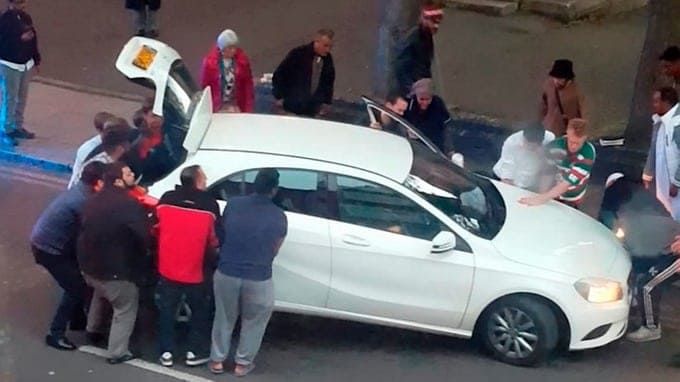 Watch – Moment bystanders LIFT a car off a school boy