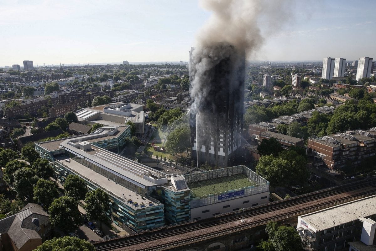 The fire struck the 27-storey Grenfell Tower in Latimer Road, White City, London 14 June 2017, in the early hours of Wednesday morning. Several people are being treated for a 'range of injuries' including illness from smoke inhalation. One neighbour said he believed someone had jumped from about 10 to 15 floors to escape the fire. The fire has spread from the second floor to the roof of the enormous 120-flat block, with 200 firefighters struggling to bring it under control.