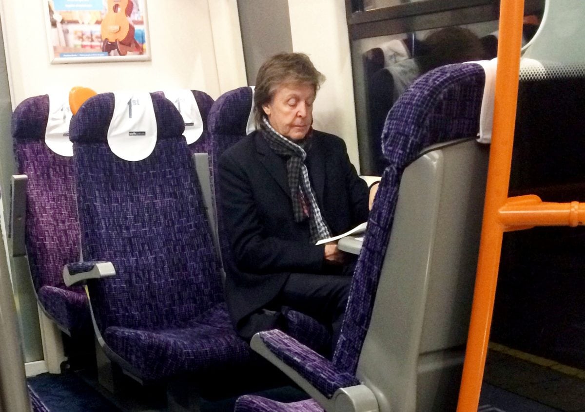 Ticket to ride: Paul McCartney spotted sitting alone on a train out of London