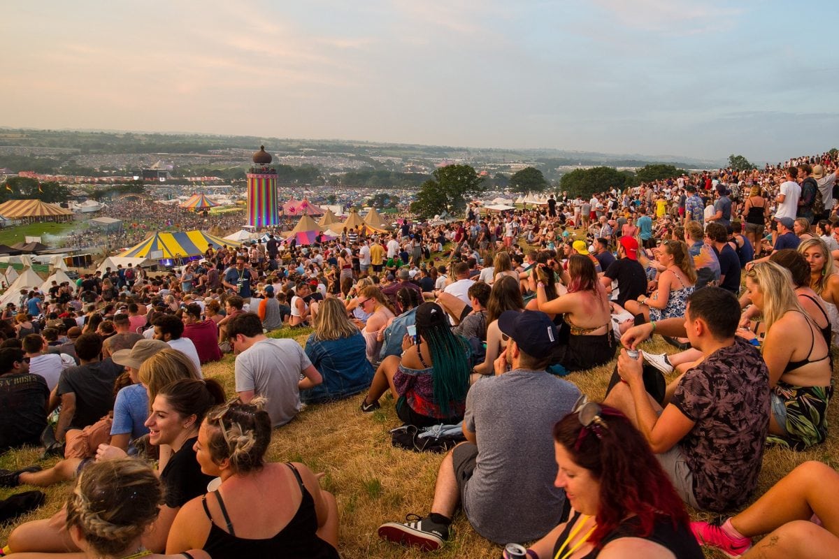 Revelers enjoy the sunset at Glastonbury Festival at Worthy Farm, Somerset, as the hottest day of the year comes to an end. June 21 2017.