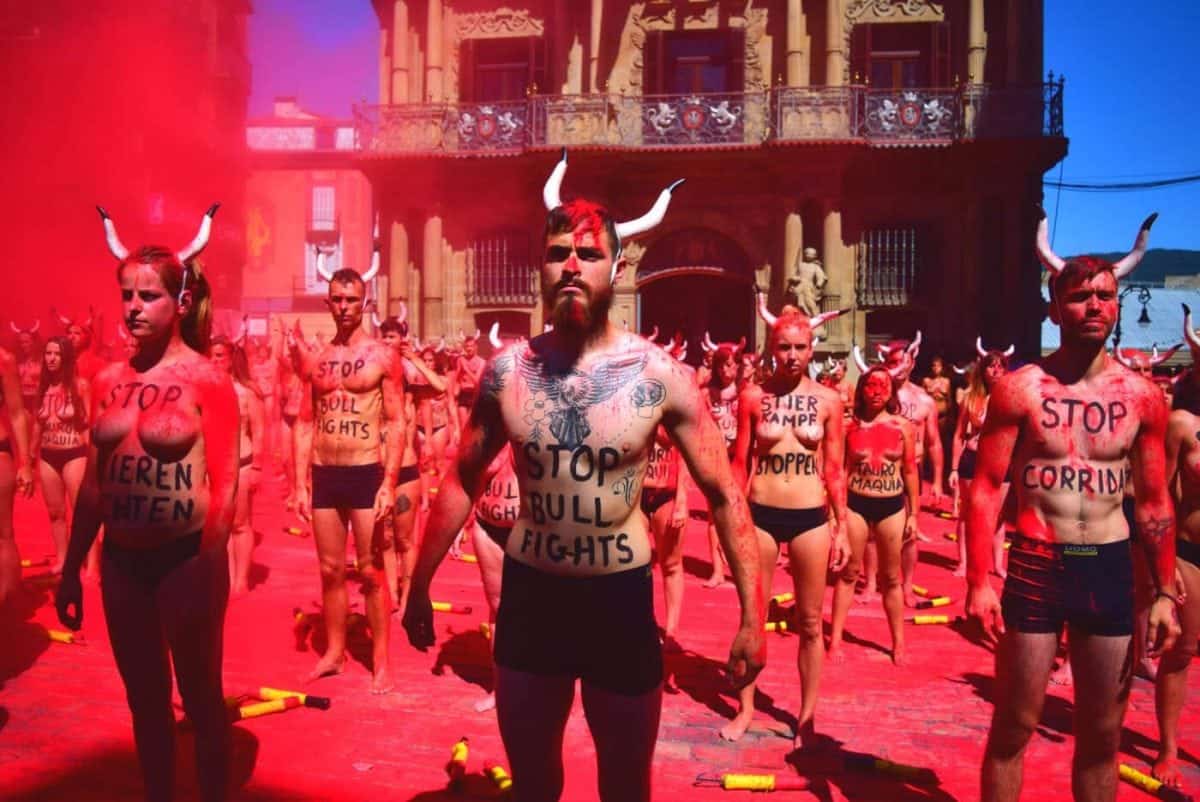 Hundreds of naked protesters march to end bloody bullfights in Pamplona