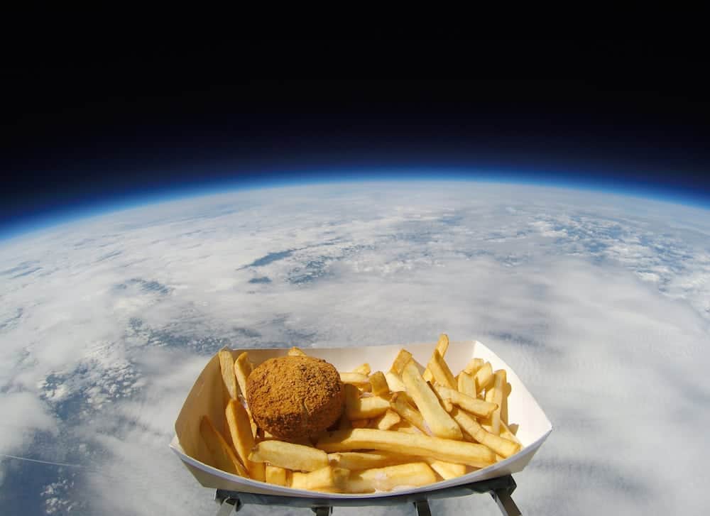 A RADIO station has joined the race for space - by blasting a beloved savoury dish into the stars. See Ross Parry story RPYPATTIE; The NASA-style space mission took off at 8.55am, as a Hull Pattie, along with a portion of chips sprinkled with chip spice, was shot almost 38,000 metres into the stratosphere tethered to a high-altitude weather balloon. The pattie was launched from a site in Sheffield, and reached a height of over 123,000ft  where temperatures fell to -50c and winds hit 150mph. An on-board camera filmed the tasty expedition, providing some stellar footage and data, as the meal touched down in a field just outside Wragby at 12.18pm.