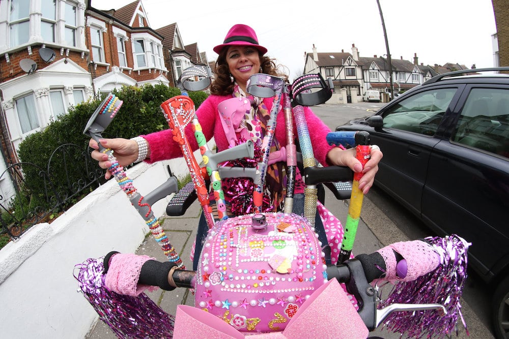 Sarah Chelsom who is famous in South Norwood for her pink and highly decorated scooter. See National News story NNSCOOTER: A disabled woman says she was punched in the head for cruising around town on her bright pink mobility scooter - that is decorated with gemstones. Sarah Chelsom, who glammed-up her scooter with diamantes and rhinestones simply to make her neighbours' smile, says she was punched in back of the head as she rode around her home estate. Flamboyant Sarah, 51, from South Northwood, south London, is calling for more bobbies on the beat after she was left frightened after the unprovoked attack by an unknown female assailant. Sarah, said: "Since then I felt so frightened and shaken up that I couldn't sleep and that's when I knew I needed to do something, South Norwood has gone downhill and even more so since the police station closed.