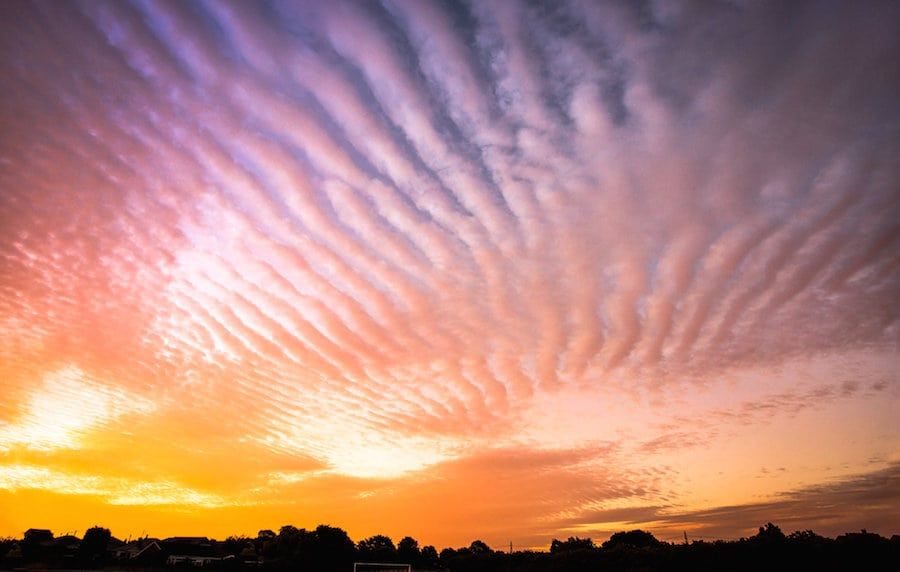 A glorious sunrise caught on a mackerel sky over Normanton, West Yorkshire. The term is used when the sky is full of rows of cirrocumulus or altocumulus clouds displaying in an undulating and rippling pattern similar in appearance to the fishes scales. July 27 2017.