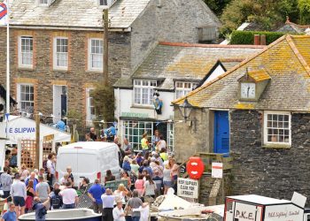 These pictures show Doc Martin filming with Hollywood A lister Sigourney Weaver, See SWNS story SWALIEN; These photos show the Alien star dressed up with a hat and camera around her neck,playing the part of Beth Traywick, the famous show which is filmed in Port Isaac, Cornwall.