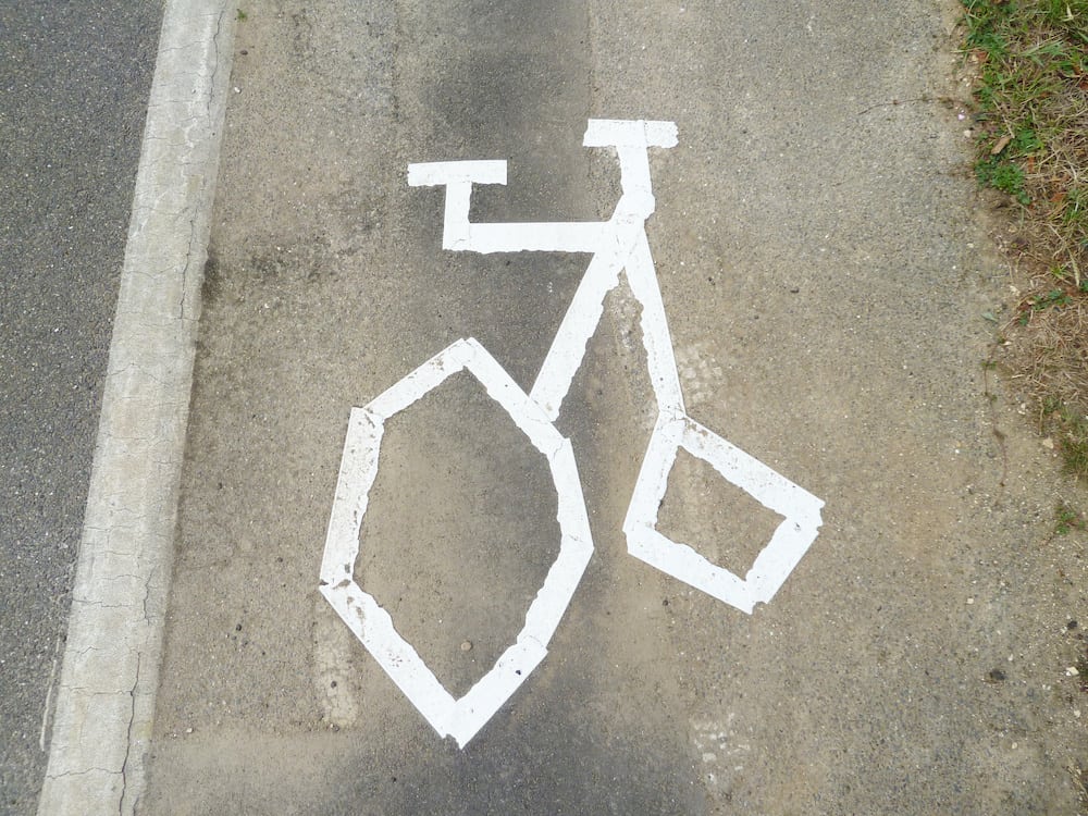 Road user baffled by wonky penny farthing cycle symbol drawn by workmen