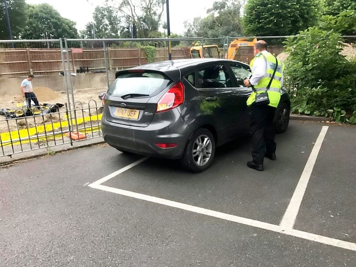 Baffled residents were left outraged after a parking warden left his car carelessly across half a bay - and say he should have given himself a ticket.  See NATIONAL story NNPARK.  A picture snapped by local Steven Way shows the enforcement officer's shoddy parking outside the white lines, although not obstructing other cars.  The grey 17-plate Ford Fiesta, driven by a Shepway District Council warden, was spotted in Hythe, Kent, on Monday morning.  Steven, a chartered building surveyor, stressed that the officer "shouldn't need to be told" how to park correctly in the bay.