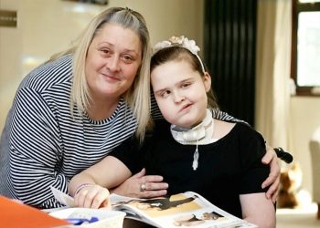 Emma Garbutt and her daughter Millie.  A young girl who lost her voice after brain tumour surgery can now only communicate using her iPad - and SIRI. See NATIONAL story NNIPAD.  Millie Garbutt was left unable to speak after having a life-saving tracheotomy after doctors operated on a brain tumour.  Now the 12-year-old has to communicate using the text-to-speech function on her tablet computer - that uses the same voice as Apple's 'virtual assistant' Siri.  Mum Emma Garbutt said: "She has an iPad and another electronic device which attaches to her wheelchair and helps her communicate with everyone.
