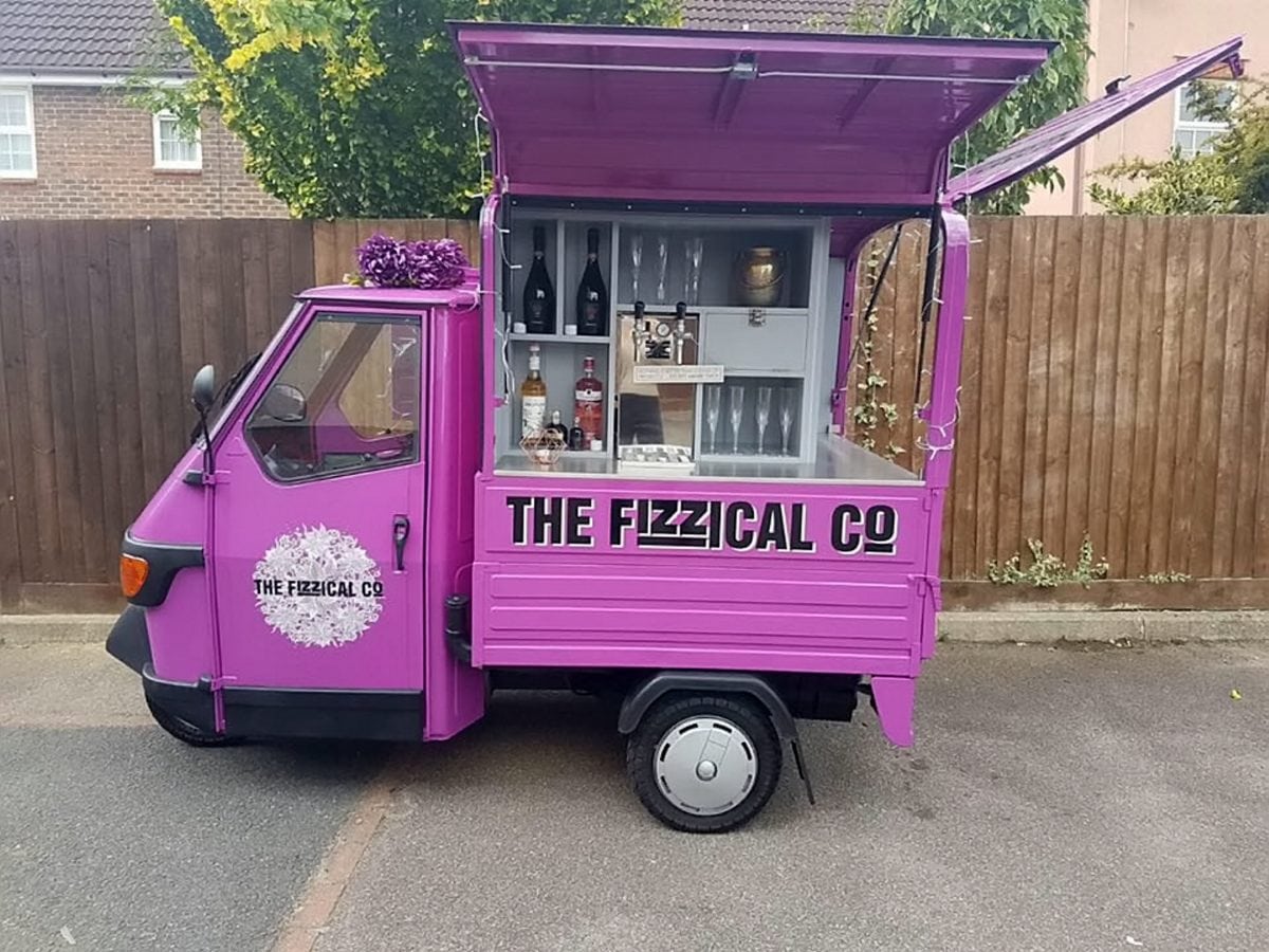 Italian moped turned into a pink prosecco van delivery service