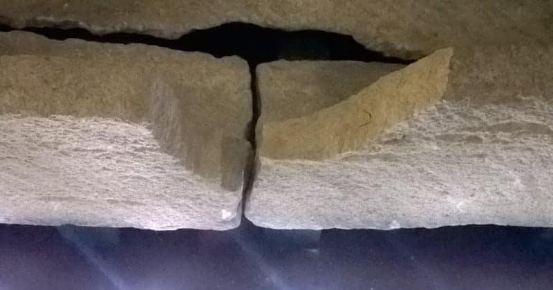 An 800 year-old stone coffin has been broken after a child was lifted inside it for a photograph at a museum