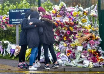 FILE PICTURE - A group of girls console each other in front of a floral tribute in memory of Bailey Gwynne is seen outside the gates to Cults Academy near Aberdeen, Scotland on October 29 2015.See Centre Press story CPBAILEY; This is the face of the killer who stabbed a fellow school pupil to death and can legally be named for the first time after turning 18-years-old. Daniel Stroud was found guilty of stabbing Bailey Gwynne to death in the corridors of a high-achieving secondary school as an argument took a dark turn for the worse. Stroud regularly brought knives with him to Cults Academy in Aberdeen prior to the incident which cost Bailey his life on October 28 of 2015. The fight was said to have started over a biscuit and escalated when someone called Bailey's mum fat.