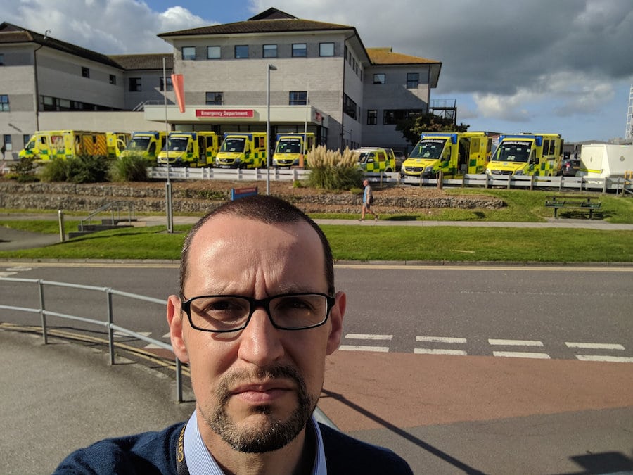 TEN ambulances queuing outside overstretched A&E with patients treated inside vehicles & corridors