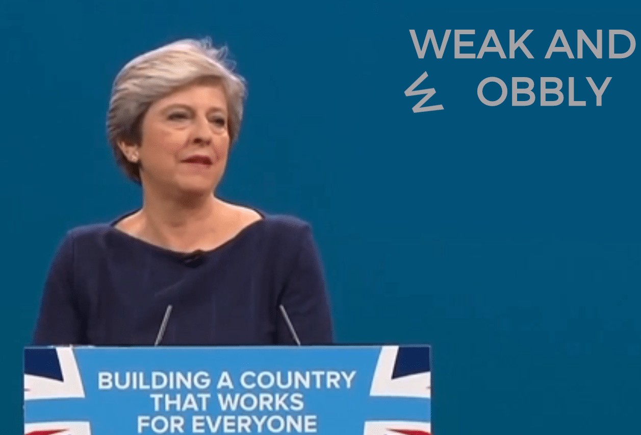 Have your own phrase fall off a wall behind Theresa May