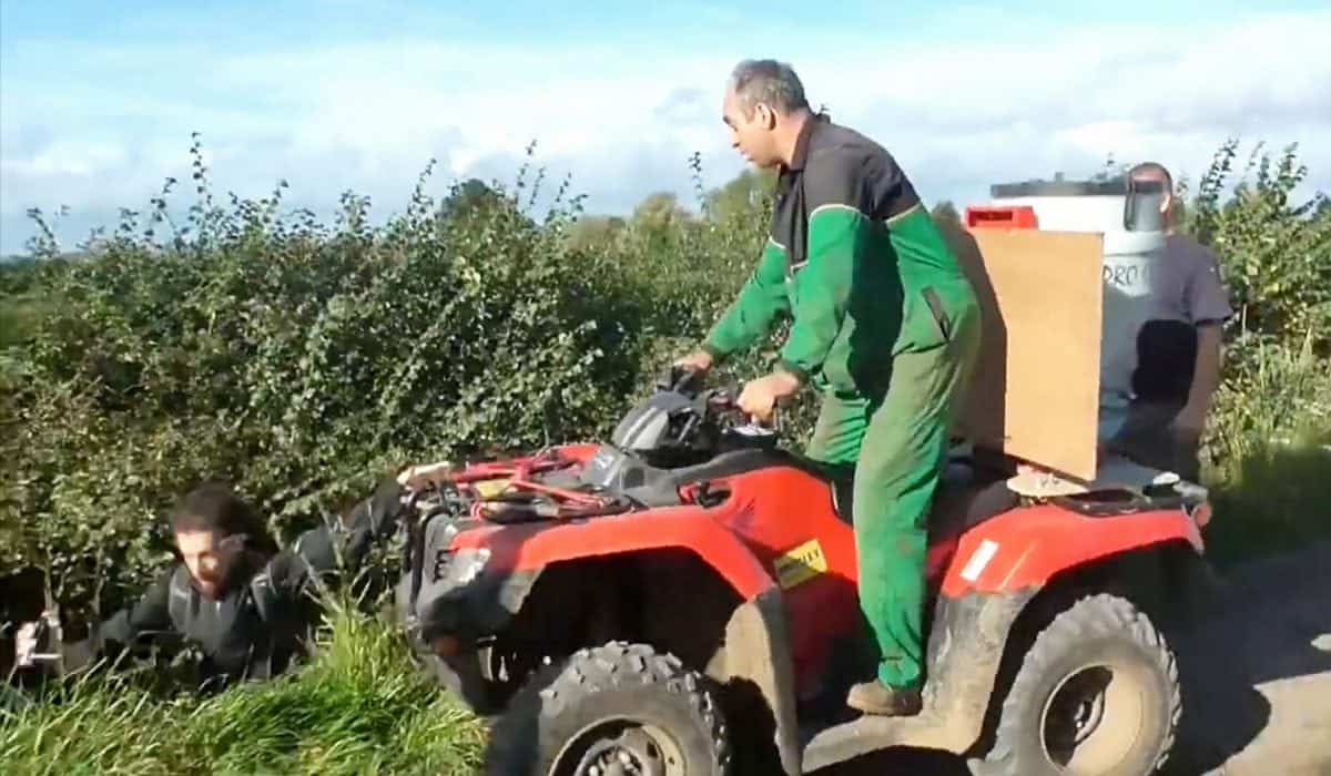 This is the shocking moment a farmer was caught on camera driving a quad bike at a group of fox hunt demonstrators.  See NTI story NTIHUNT.  Footage released by West Midlands Hunt Saboteurs shows an altercation between a member of Atherstone Hunt and a group of protestors filming the hunt on their mobile phones.  The farmer, dressed in John Deere overalls, drives a quad bike up to three men and shouts at them to get off his land.  He then pushes one into a ditch and begins attacking whoever he can reach in the three-and-a-half minute video.  He confronts the demonstrators and tries to prevent them filming him before knocking another to the ground.  He continues to drive at the protestors with his quad bike, telling them, You are on private property, I can do what I want.  The dramatic footage filmed on Saturday (14/10) in Ratcliffe Culey, Leics., captures the moment the farmer drives another person into a ditch and can be heard saying, Thats one more, does anybody else want some?