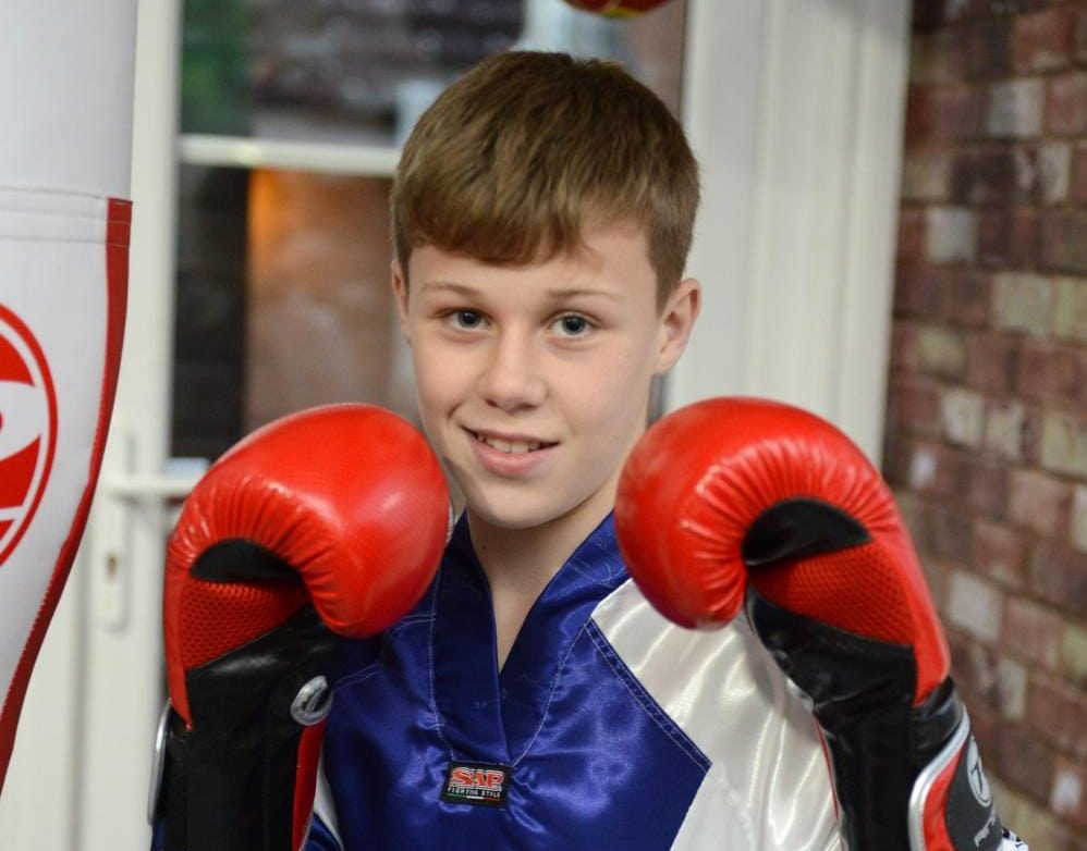 Kickboxing kid comes back from disease to become world champion again